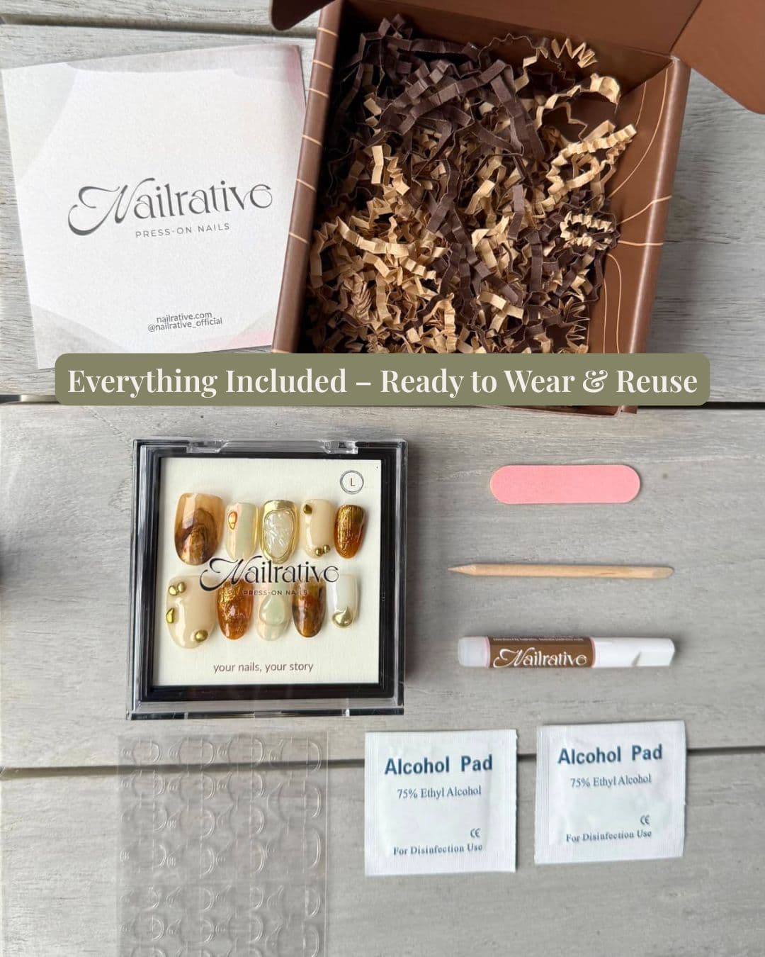 Flat lay of Nailrative press-on nail kit, including a branded black box, nail set, adhesive tabs, mini nail file, cuticle stick, and prep pad — elegantly arranged to showcase the premium unboxing experience.